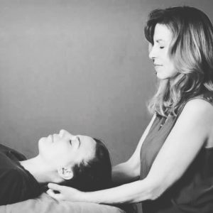 Therapist performing relaxing healing session