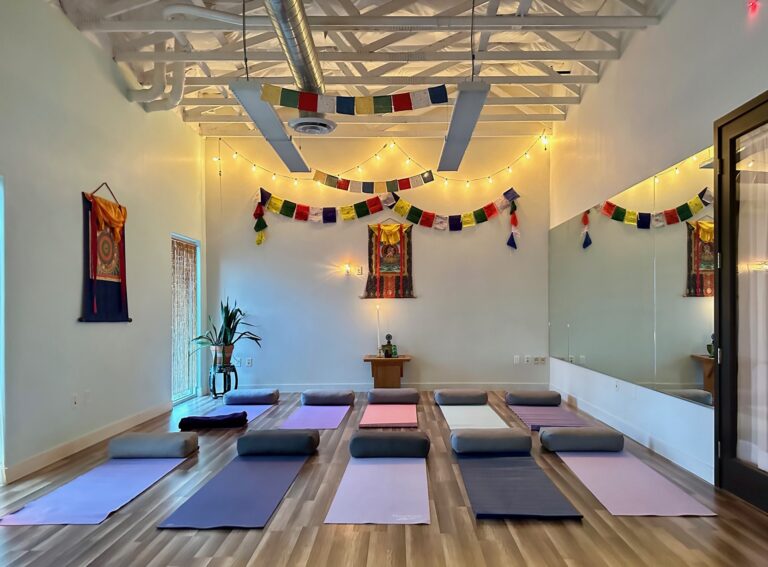 Yoga studio with mats and prayer flags