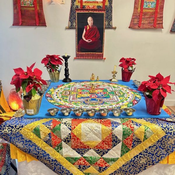Colorful Tibetan altar with mandala and decorations