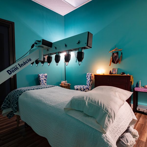 Relaxing wellness therapy room with treatment bed