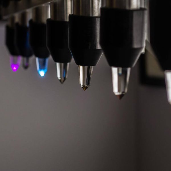 Close-up of colorful laser cutting machine nozzles